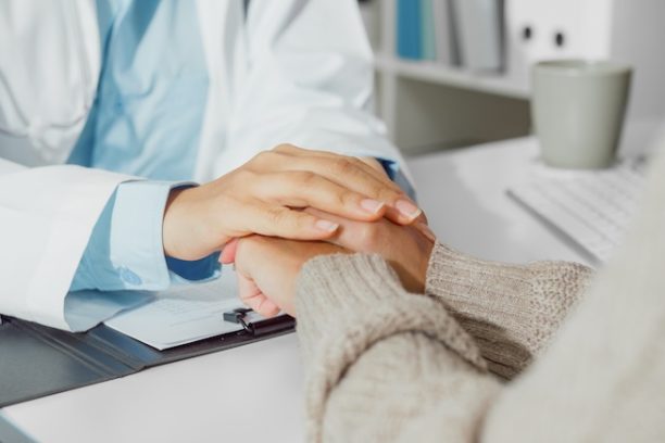 Close up of Young Asian woman doctors talking with the patient about mental health, for recover wellbeing and be a healthy lifestyle in health clinic. Medical health care concept.